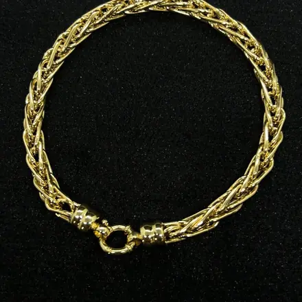 Pulseira de ouro de malha trançada