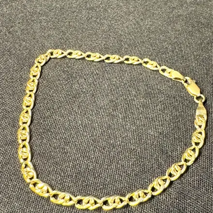 Pulseira de ouro de malha achatada