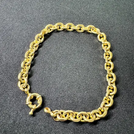 Pulseira de ouro de elos redondos com fecho de argola
